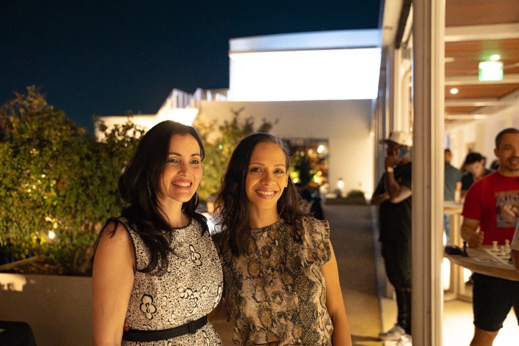 Guests at a night event on the rooftop at Retreat