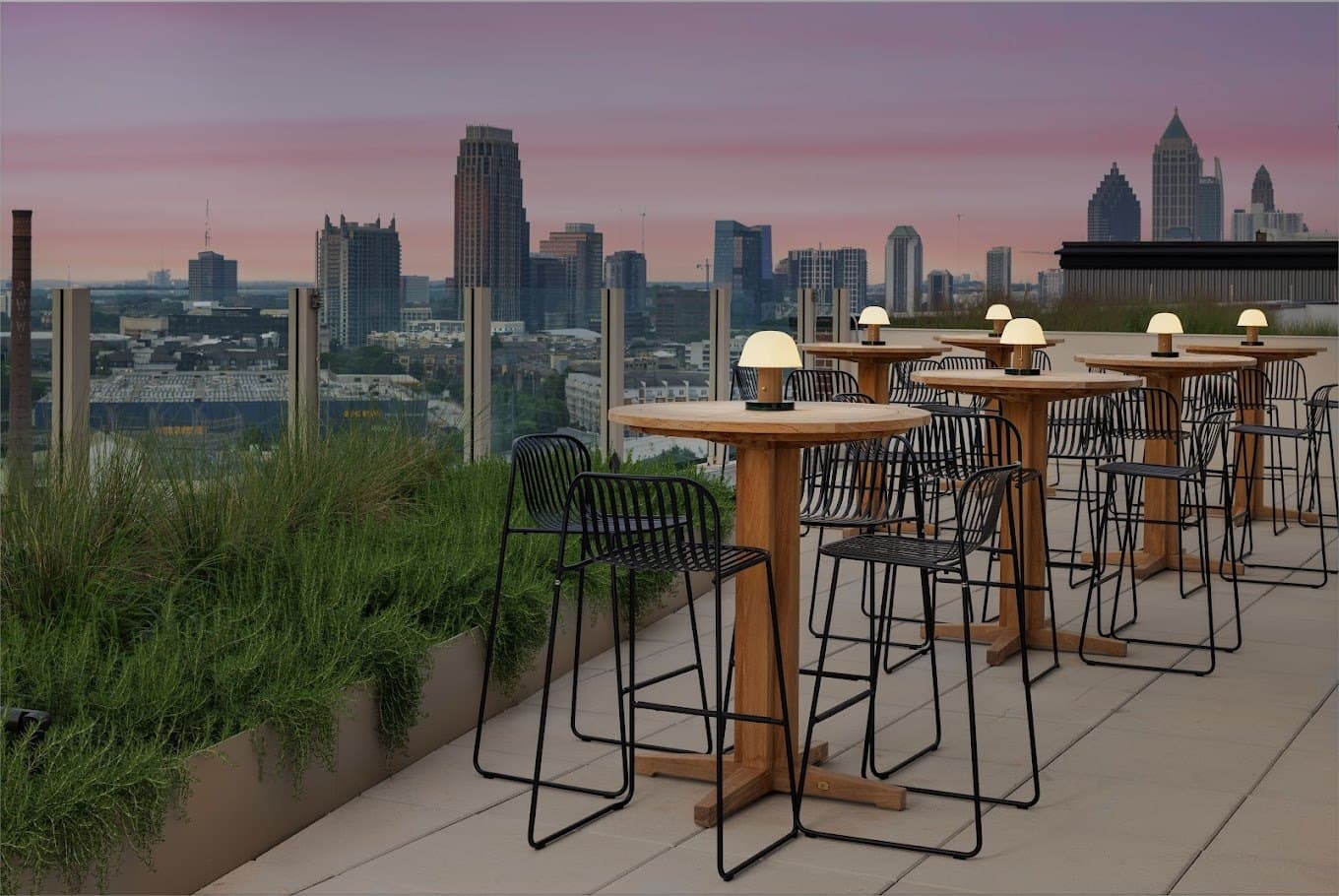 Cocktail tables on the pavilion terrace with the Atlanta skyline